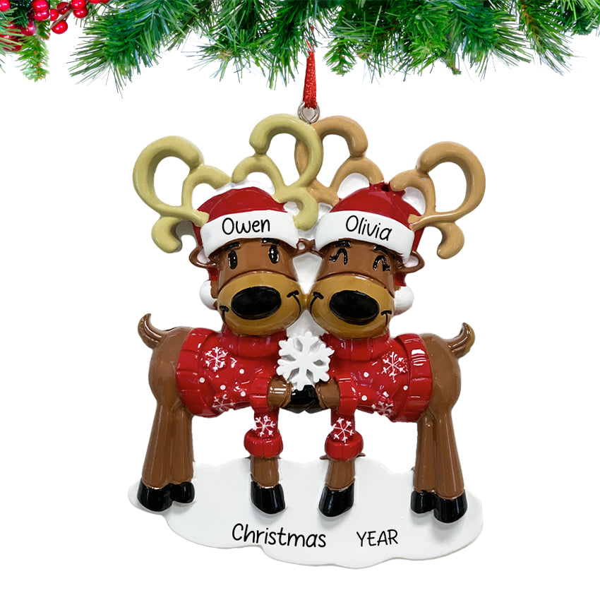 Celebrate love this holiday season with a personalized Christmas ornament featuring a reindeer couple.