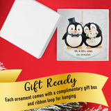 Celebrate your love story with a penguin bride and groom Christmas ornament.