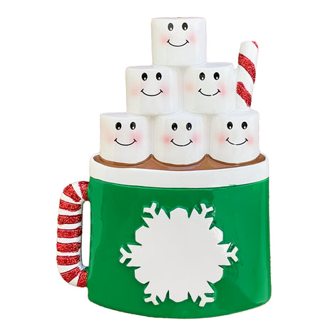 Green mug with snowflake design, candy cane handle, and smiling marshmallows on a white background
