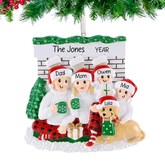Family of 4 woth dog ornament on christmas tree.