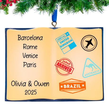 Ornament shaped like an open book with travel stamps and names on a white background