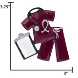Scale reference: 4‑inch burgundy scrubs ornament held in hand