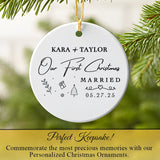 Ceramic married ornament hanging on a Christmas tree branch lit with fairy lights