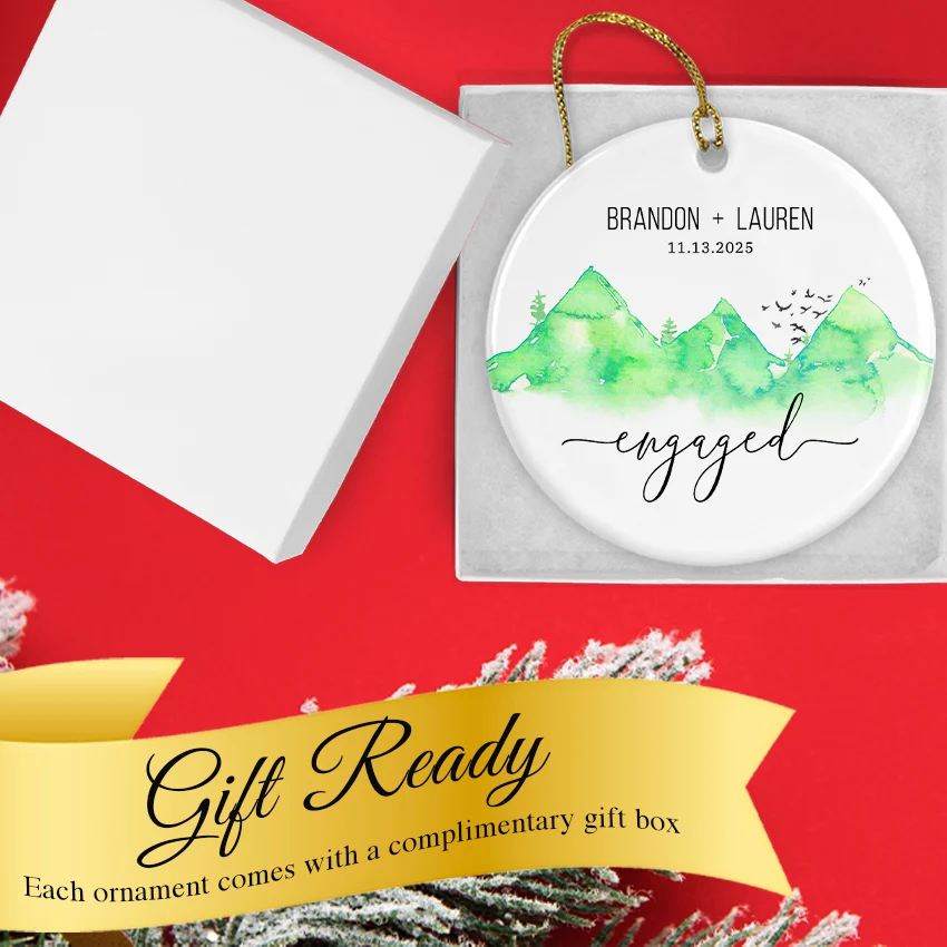 Hand holding the Green Mountain engagement ornament to show scale and personalization