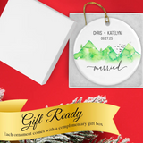 Custom wedding ornament nestled in its gift-ready keepsake box with gold ribbon