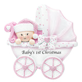 Personalized baby girl carriage Christmas ornament with custom name, perfect for her first holiday.