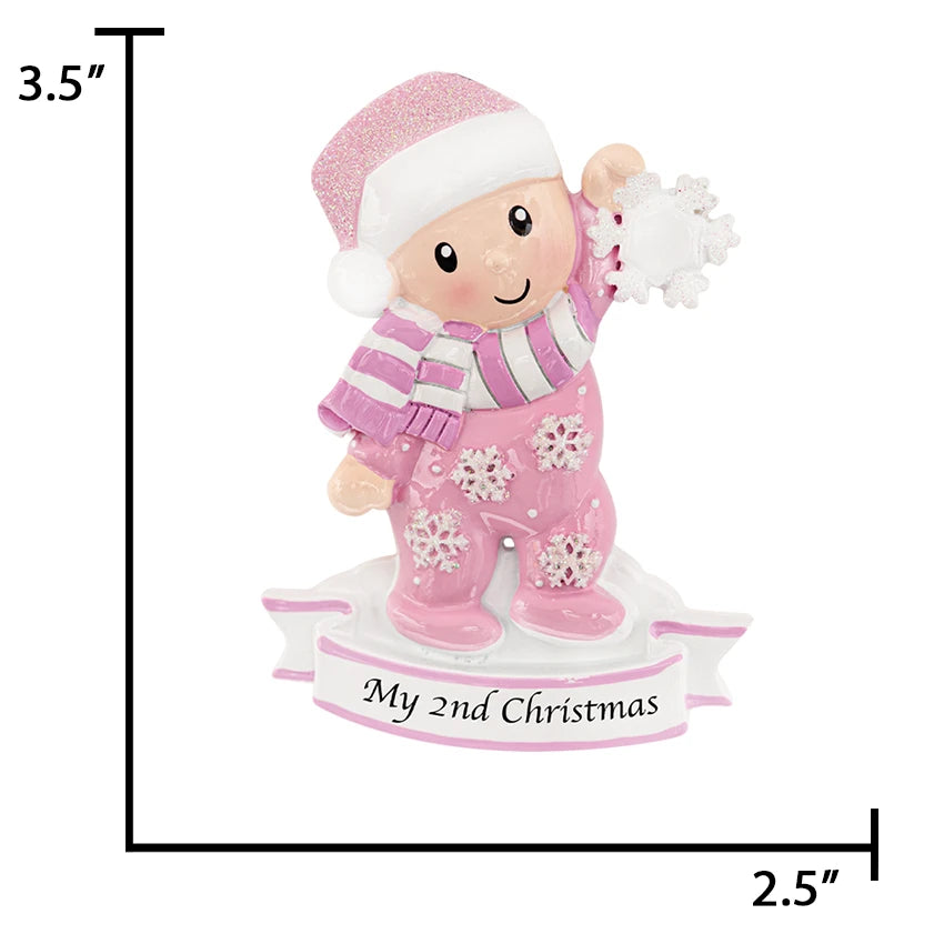 Personalized baby girl holding snowflake ornament, a unique keepsake to celebrate her special day.