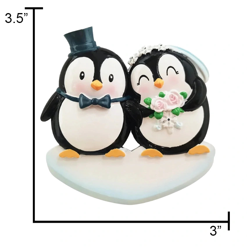 Celebrate love with a personalized penguin bride and groom Christmas ornament from Gift Shopie.
