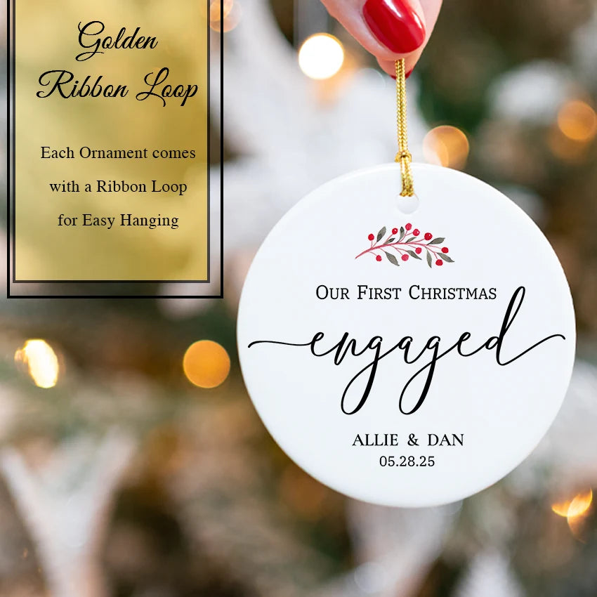 Hand holding the ceramic engagement ornament showing personalized names and date